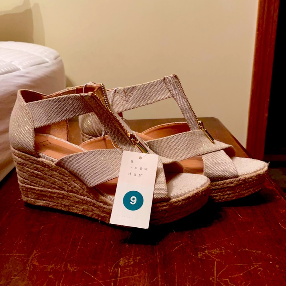 Brand is a new day. Size 9. Cream colored wedge with zipper. New with tags.
